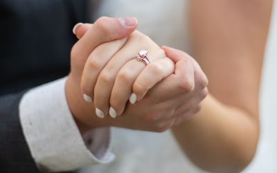 Photo of the hands of the couple at their wedding, to illustrate the article Lessons From 204 Years of Marriage.